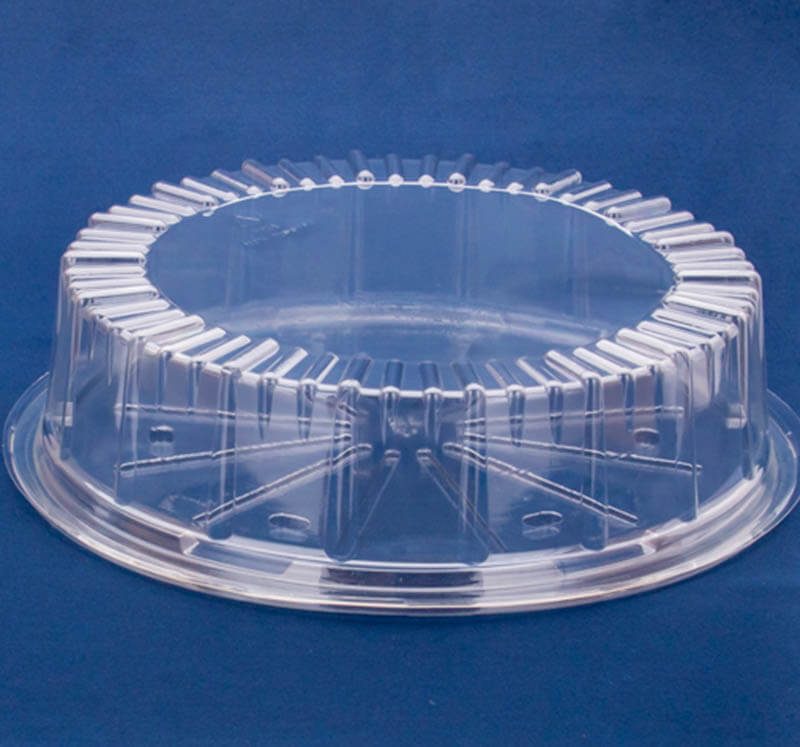 Clear round PET cake or dessert container lid made from recyclable plastic packaging, ideal for custom food packaging and sustainable presentation.