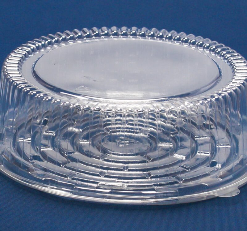 Clear PET cake container with lid made from recyclable food packaging, designed for custom plastic packaging and sustainable bakery products.
