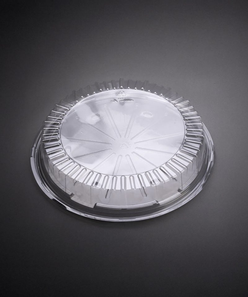 Clear round PET lid made from recyclable food packaging, ideal for custom plastic packaging for cakes, desserts, and sustainable food products