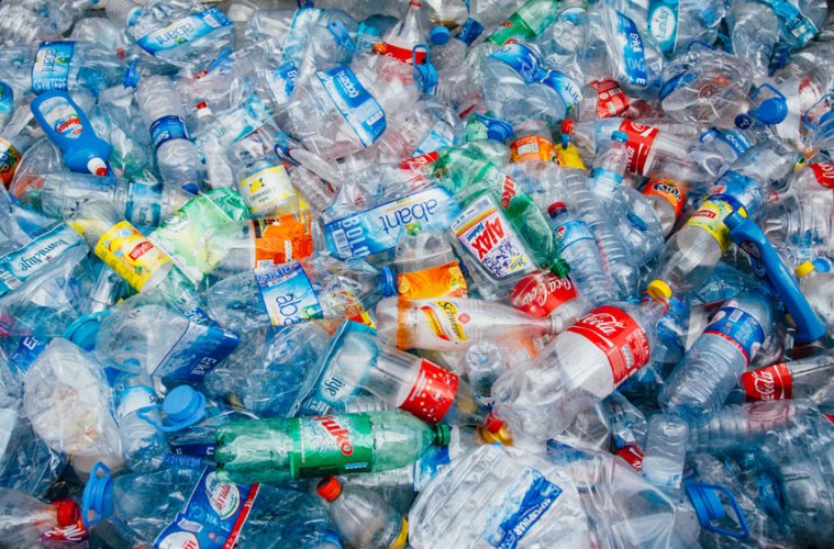 Pile of used plastic bottles ready for recycling, illustrating plastic recycling and recyclable packaging products in the circular economy.